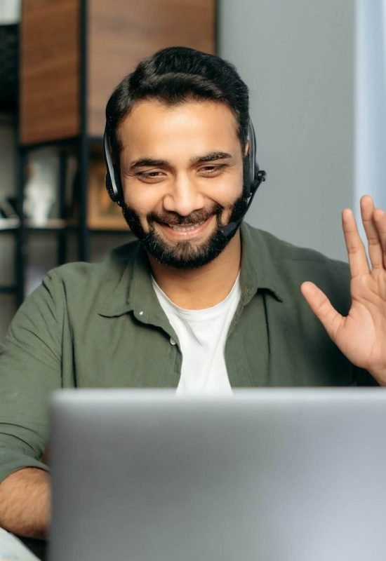 positive-attractive-indian-guy-in-headphones-hotline-operator-support-worker-online-consultant.jpg